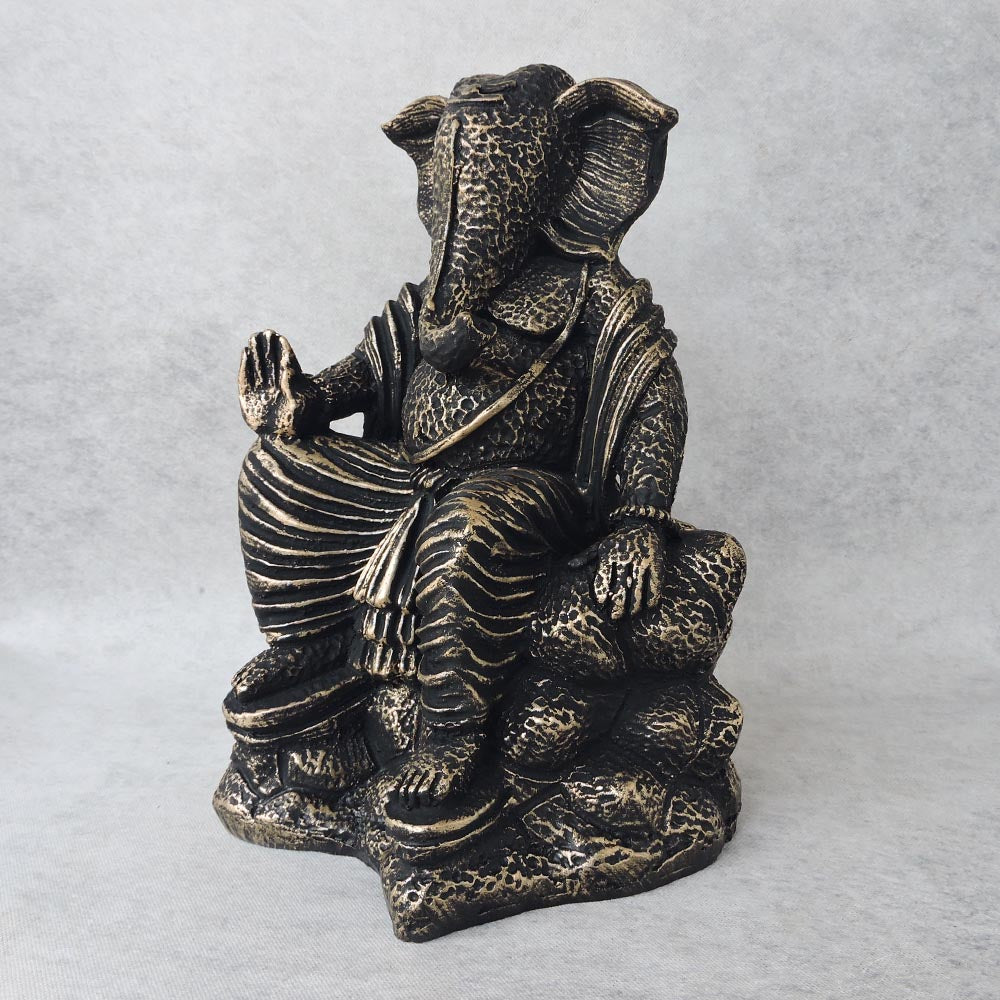 Ganesha Sitting On Stone / Metallic by Satgurus