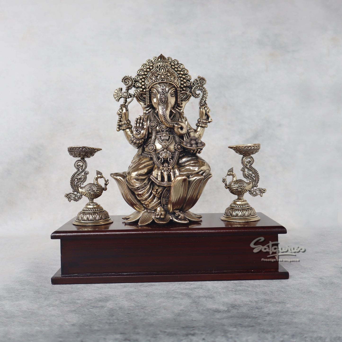Ganesha With Lamps On Base by Satgurus