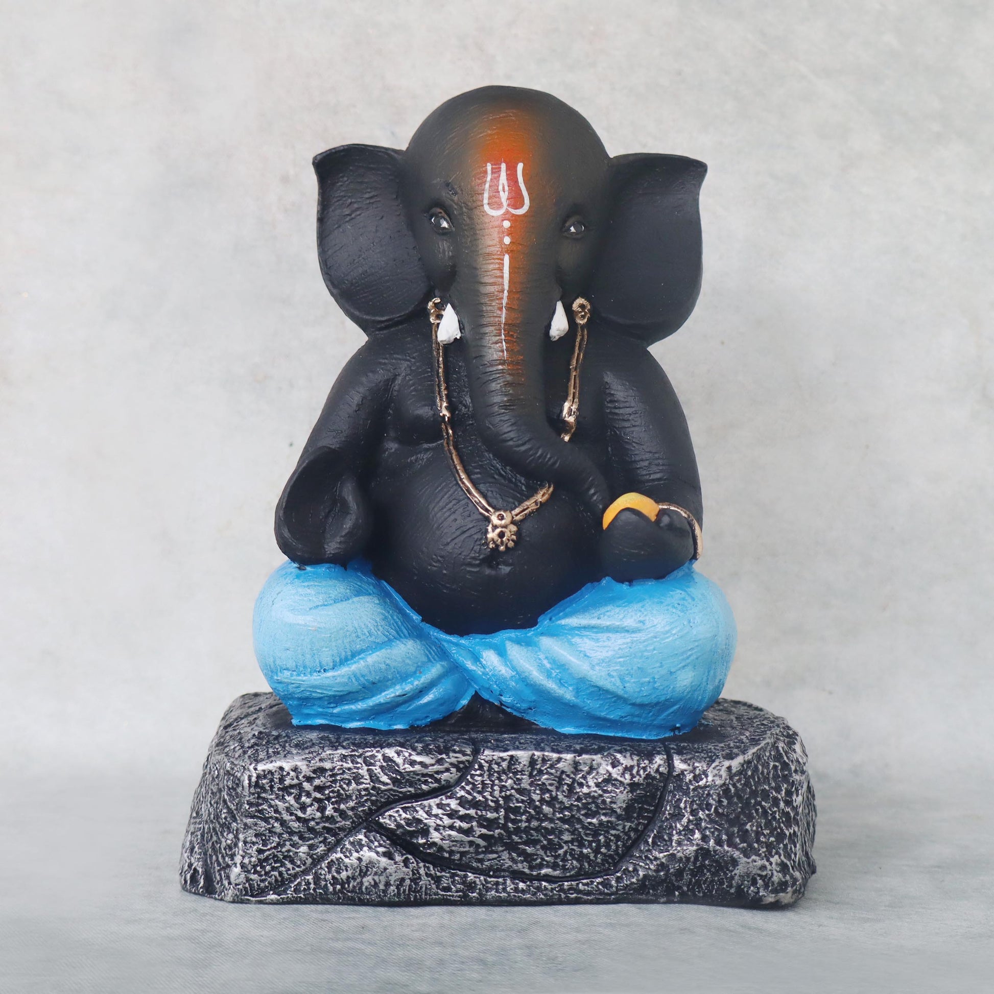 Ganesha Sitting On Stone / Blue by Satgurus