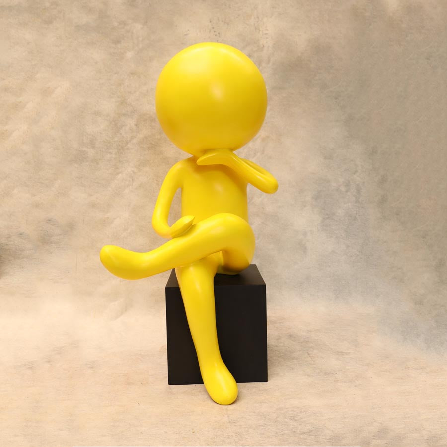 Yellow Modern Mnimalist Sitting Human Figurine By Satguru's